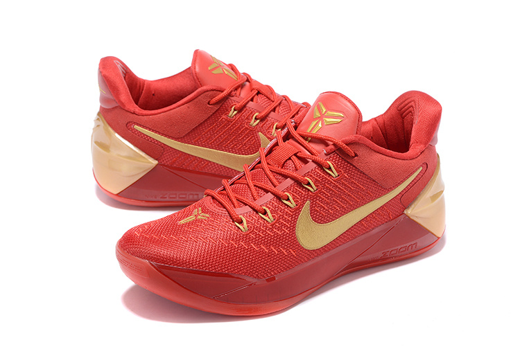 red and gold nike shoes